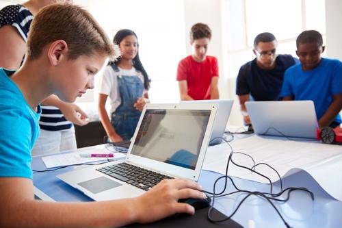 A group of students using laptops