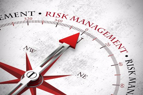 A risk management compass with arrows. 