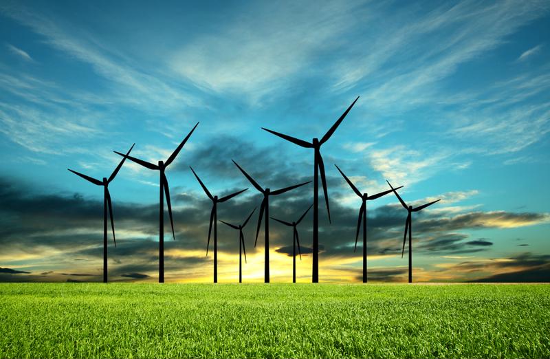Wind farm against a sunset.