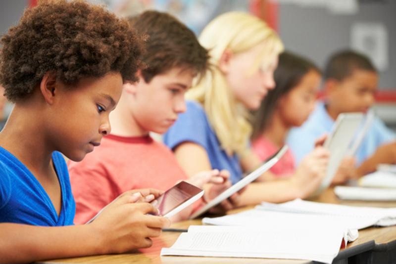 Students use tablets in the classroom