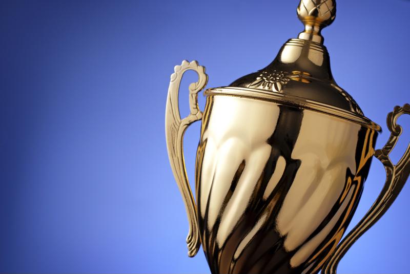 Gold trophy with a blue background